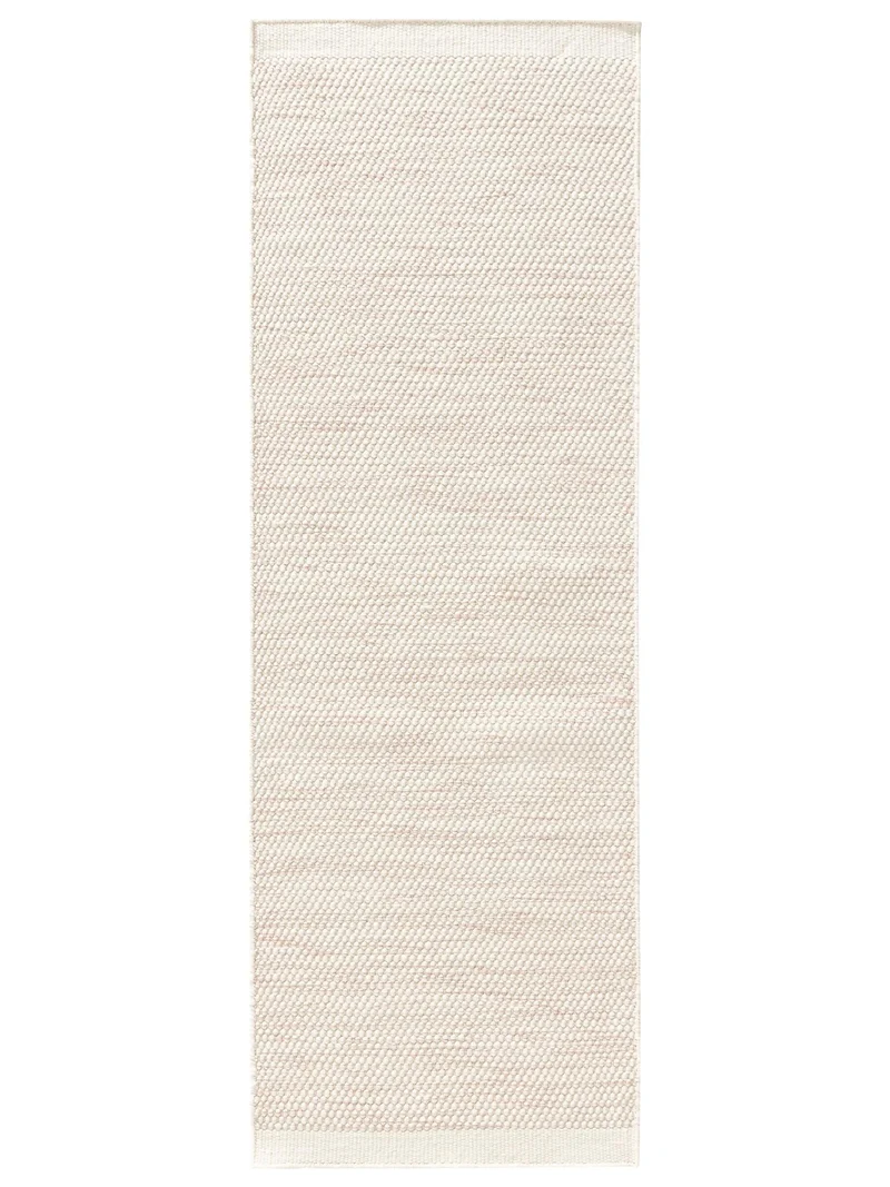 Tapis scandinave tressé descente de lit enfant crème et corail en laine 70x200 cm