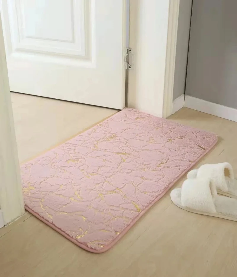 Tapis de bain rose et doré